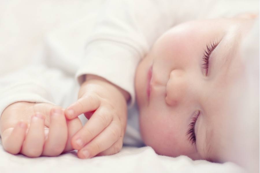 Should you let sick toddler sleep all day -A close-up portrait of a beautiful sleeping child 