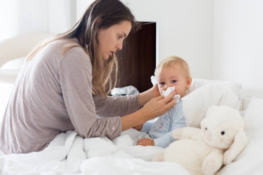 Should you let sick toddler sleep all day -Mom is taking care of her sick toddler boy