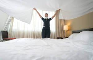 How often do hotels change bed sheets
